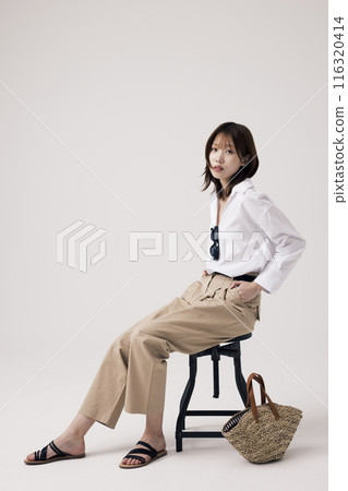 Korean Woman Sitting in Chair in Old Money Style Korean Woman Sitting in Chair in Old Money Style 116320414