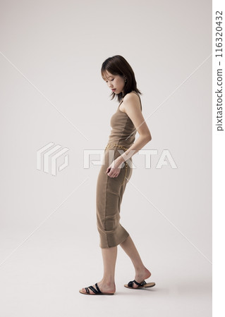 Side view of a Korean woman in an old money Style Side view of a Korean woman in an old money Style 116320432