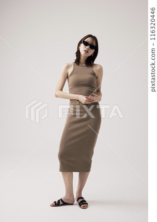 a Korean woman in a tight dress and sunglasses 116320446