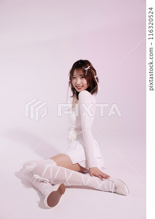 A Korean woman in her 20s who poses on the floor wearing a ballet core look A Korean woman in her 20s who poses on the floor wearing a ballet core look 116320524