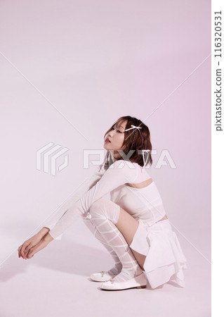 A Korean woman in her 20s who poses on the floor wearing a ballet core look A Korean woman in her 20s who poses on the floor wearing a ballet core look 116320531
