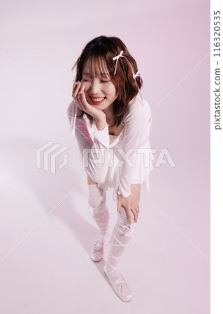 Korean woman in her 20s wearing a ballet core look and bending over and posing 116320535