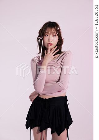 A Korean woman in her 20s who wears a ballet core look style and puts her finger on her lips A Korean woman in her 20s who wears a ballet core look style and puts her finger on her lips 116320553