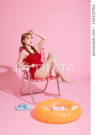 Korean woman in her 20s posing in a chair wearing a monokini look 116320561