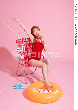 Korean Woman in Her 20s Poses With Ice Cream in Monokini Look 116320647