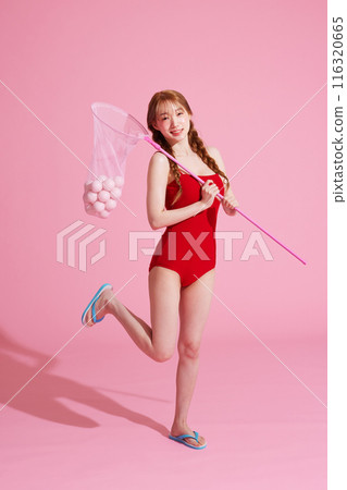 A Korean woman in her 20s wearing a monokini look and holding a dragonfly with a ball 116320665