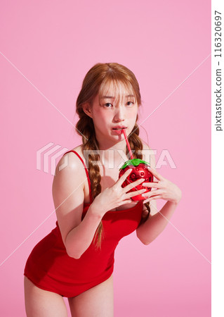 Korean Woman in Her 20s Poses With Strawberry-Shaped Beverage Korean Woman in Her 20s Poses With Strawberry-Shaped Beverage 116320697