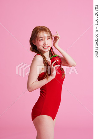 Korean Woman in Her 20s Poses With Strawberry-Shaped Beverage 116320702