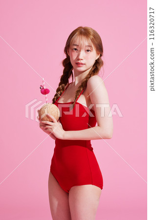 Korean Woman in Her 20s Poses With Coconut Drinks in Monokini Look Korean Woman in Her 20s Poses With Coconut Drinks in Monokini Look 116320717