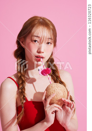 A Korean Woman in Her 20s Holding a Coconut Drink A Korean Woman in Her 20s Holding a Coconut Drink 116320723