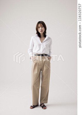 Korean Woman Poses With Her Hands On Her Pants Korean Woman Poses With Her Hands On Her Pants 116320757