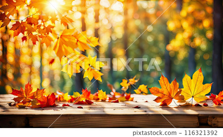 Wooden tabletop in a rustic style, decorated with autumn leaves 116321392