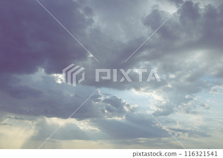 Gloomy, dark and dramatic sky before rain, cumulonimbus clouds, day, natural background Gloomy, dark and dramatic sky before rain, cumulonimbus clouds, day, natural background 116321541