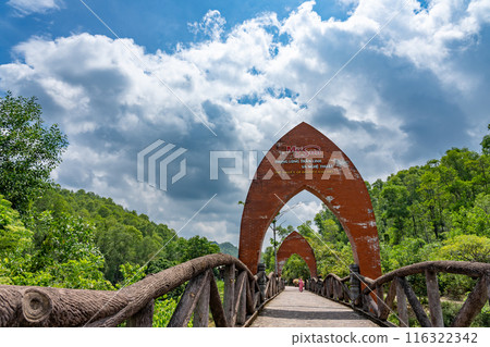 My Son ruins, a sacred place of the Champa Kingdom in Vietnam, dedicated to Hindu gods. A bridge and gate just after entering the entrance gate. My Son ruins, a sacred place of the Champa Kingdom in Vietnam, dedicated to Hindu gods. A bridge and gate just after entering the entrance gate. 116322342