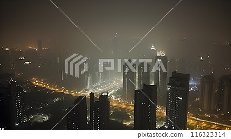 Aerial city landscape at night, misty foggy air and the street full of light. 116323314