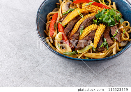 Udon noodles with beef and vegetables for the menu, website, restaurant or food delivery 116323559
