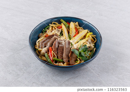 Udon noodles with beef and vegetables for the menu, website, restaurant or food delivery 116323563