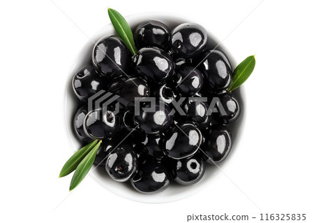 Black olives, glossy and plump, with a small sprig of green leaves, isolated on a white background 116325835