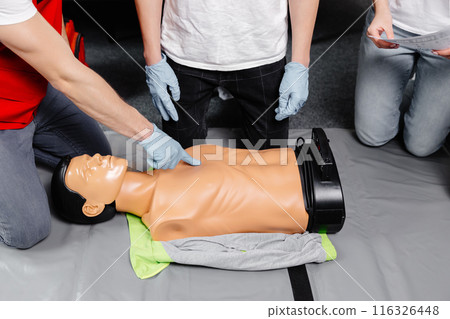 First Aid Training - Cardiopulmonary resuscitation. First aid course on cpr dummy. First Aid Training - Cardiopulmonary resuscitation. First aid course on cpr dummy. 116326448
