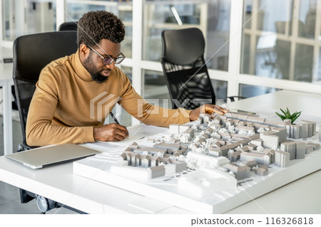 African american architect working in his office and looking involved 116326818