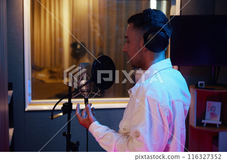 Man Recording His Song In Studio 116327352