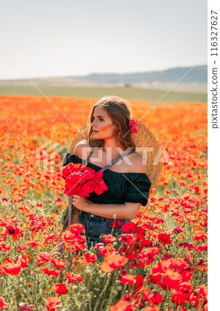 Woman poppies field. portrait happy woman with long hair in a poppy field and enjoying the beauty of nature in a warm summer day. 116327627
