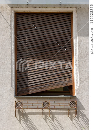 Window with an oblique shutter, Piestany, Slovakia Window with an oblique shutter, Piestany, Slovakia 116328256