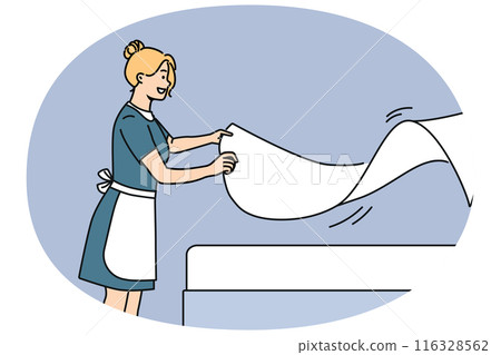 Woman maid makes bed with sheets, preparing hotel room for arrival of new guests 116328562