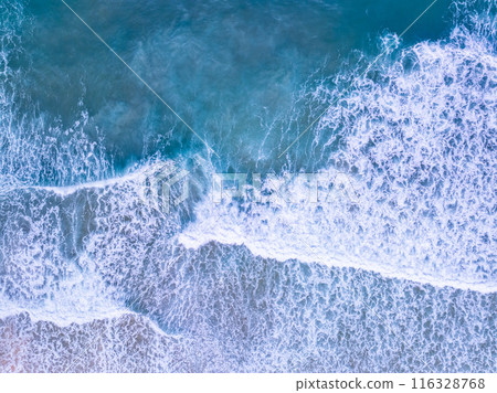 Aerial top view nature background of waves crashing in the ocean sea water, Drone view of sea waves in bird eye waves photo,Waves background 116328768