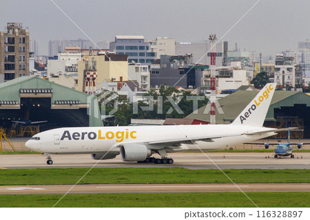 A Boeing 777-FZN Airplane Of AeroLogic Taxiing At Tan Son Nhat International Airport. A Boeing 777-FZN Airplane Of AeroLogic Taxiing At Tan Son Nhat International Airport. 116328897