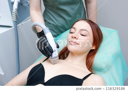 A woman is getting a facial treatment A woman is getting a facial treatment 116329186