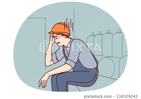 Tired man working in factory sits near production equipment holding head because of nervous job Tired man working in factory sits near production equipment holding head because of nervous job 116329242