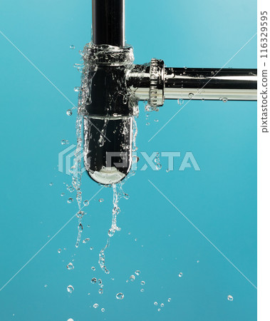 Water leak under sink on Nut Bolt stainless steel. Drain sink leak water from pipe plumbing in bathroom and repair by flume wrench tools as water splash drop. Blue background isolated 116329595