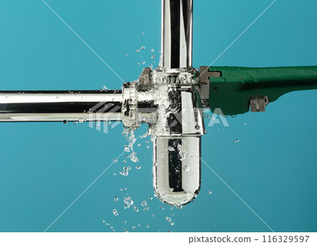 Heavy Duty Wrench fix Water leak under sink. Drain sink leak water from pipe hose plumbing in bathroom and repair by wrench tools as water splash drop. Blue background isolated Heavy Duty Wrench fix Water leak under sink. Drain sink leak water from pipe hose plumbing in bathroom and repair by wrench tools as water splash drop. Blue background isolated 116329597