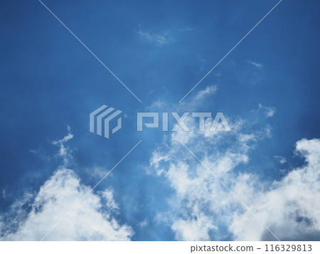 Unique clouds floating in the blue sky Unique clouds floating in the blue sky 116329813