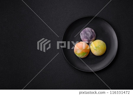 Delicious sweet chilled mochi desserts with fruit filling Delicious sweet chilled mochi desserts with fruit filling 116331472