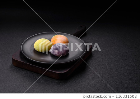 Delicious sweet chilled mochi desserts with fruit filling Delicious sweet chilled mochi desserts with fruit filling 116331508