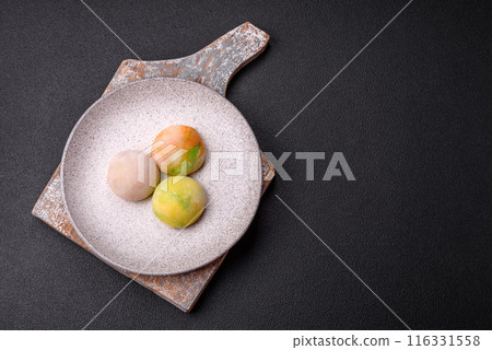 Delicious sweet chilled mochi desserts with fruit filling Delicious sweet chilled mochi desserts with fruit filling 116331558