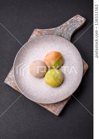 Delicious sweet chilled mochi desserts with fruit filling 116331563
