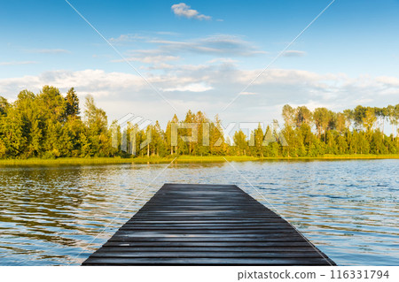 An empty wet wooden swimming pier perspective view An empty wet wooden swimming pier perspective view 116331794