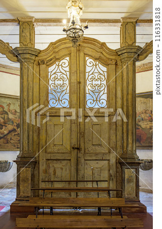 Old baroque wooden portal 116331818