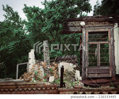 Abandoned ruined house with broken windows, Kyiv, Ukraine. Burnt building, close up. Demolished house in historic district, Kyiv. Exterior of destroyed scary house. Destroyed historic architecture. Abandoned ruined house with broken windows, Kyiv, Ukraine. Burnt building, close up. Demolished house in historic district, Kyiv. Exterior of destroyed scary house. Destroyed historic architecture. 116333495