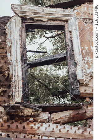 Abandoned ruined house with broken windows, Kyiv, Ukraine. Burnt building, close up. Demolished house in historic district, Kyiv. Exterior of destroyed scary house. Destroyed historic architecture. Abandoned ruined house with broken windows, Kyiv, Ukraine. Burnt building, close up. Demolished house in historic district, Kyiv. Exterior of destroyed scary house. Destroyed historic architecture. 116333496
