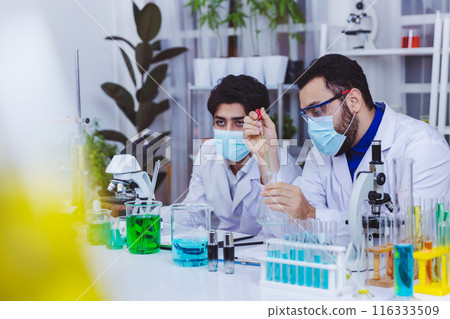 Scientist and people in science exam, test or group project in experiment at laboratory. Scientist and people in science exam, test or group project in experiment at laboratory. 116333509