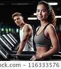 Young couple working out in a gyme 116333576