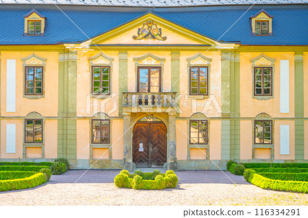 A view of the facade of the small baroque chateau Potstejn in Czech Republic. The chateau is a popular tourist destination and features a beautiful garden. A view of the facade of the small baroque chateau Potstejn in Czech Republic. The chateau is a popular tourist destination and features a beautiful garden. 116334291