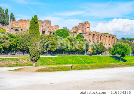 The Circus Maximus, Italian: Circo Massimo, an ancient Roman chariot-racing stadium and mass entertainment place in ancient Rome, Italy. With buildings of Palatine Hill on background 116334336