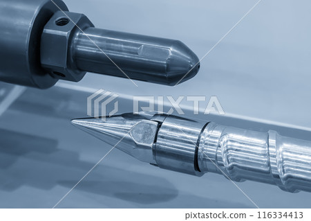 Close up scene the head barrel screw of injection machine spare parts in the light blue scene. Close up scene the head barrel screw of injection machine spare parts in the light blue scene. 116334413