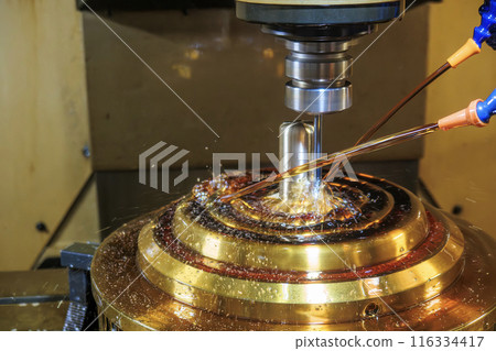 The CNC milling machine cutting the shell mold parts with oil coolant method. 116334417