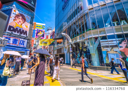 Tokyo cityscape, Japan. July. Shibuya Center Street in front of Shibuya Station (bustling with foreign tourists). A ray of hope... = 5th 116334768